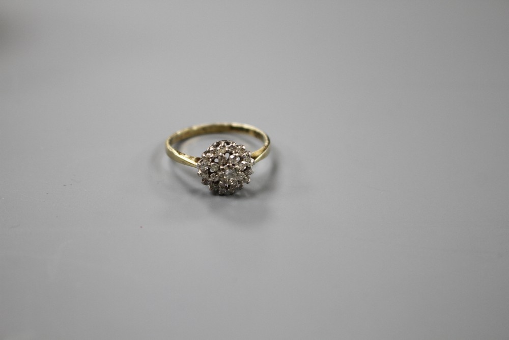 A modern 9ct gold and diamond cluster ring, size O, gross weight 2.2 grams.